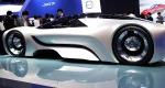 The image features futuristic concept cars on display at a Japanese auto show.